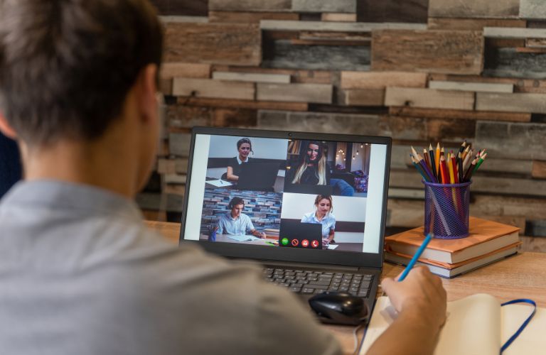 Man on Video Conference Call on a Laptop at Home