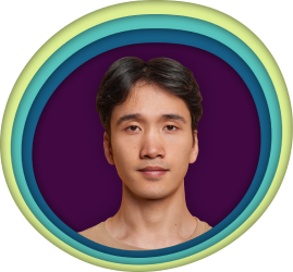 A man with dark hair and a purple background