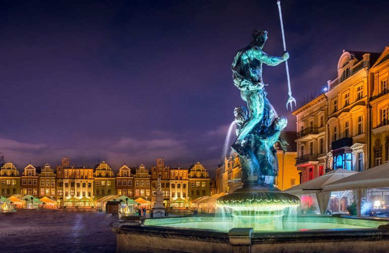 Fountain and Building in Poland Lit Up at Night