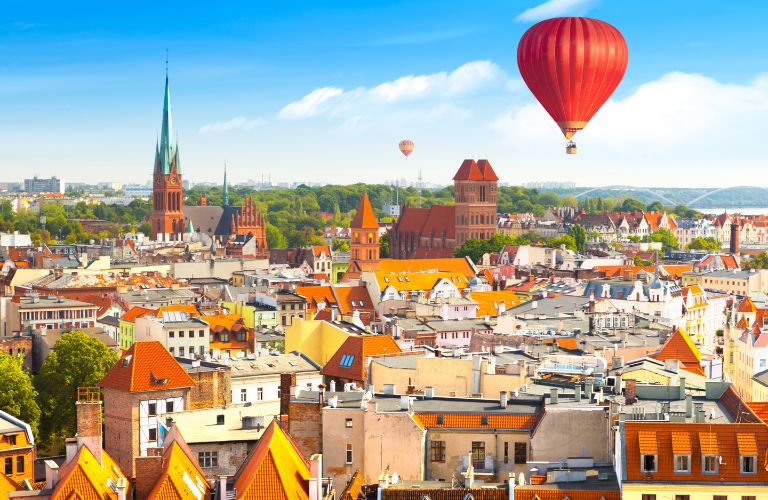 Polish City Skyline with Red Hot Air Balloon in the Sky