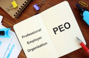 Open Notebook on a Desk with Professional Employer Organization PEO Text