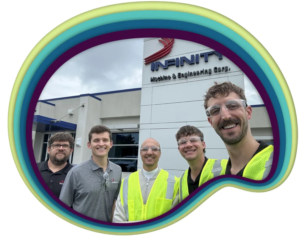 A group of professionals looking to a camera and smiling